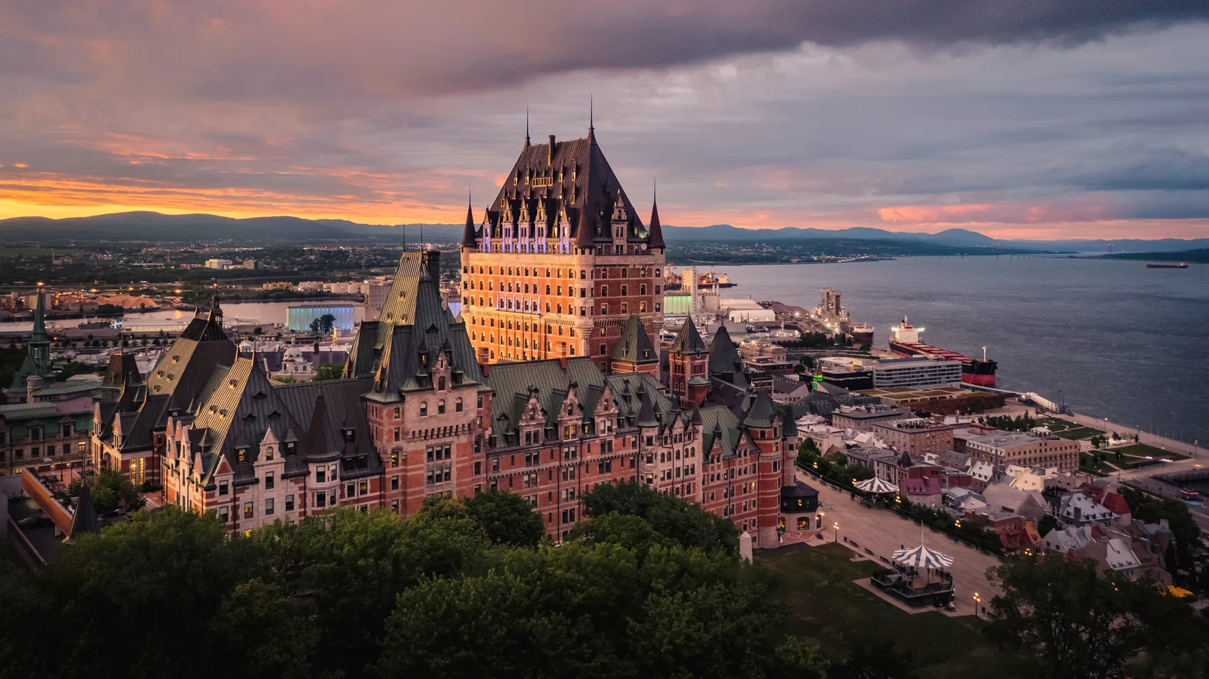 Wide landscape: the Château Frontenac and Old Québec above the St. Lawrence, ideally golden hour.